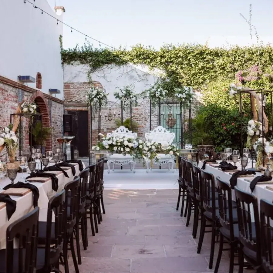 Elegant outdoor wedding reception table setting with florals and string lights in Perth — Systemly builds automated timeline and vendor follow-up systems for wedding planning businesses
